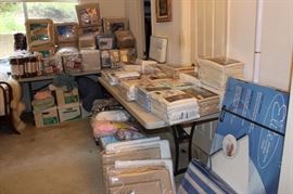 Tables of bed linens of every size, memory foam toppers, Bed in a Bag, pet proof chair covers, blankets, throws, boxes of terry robes. 