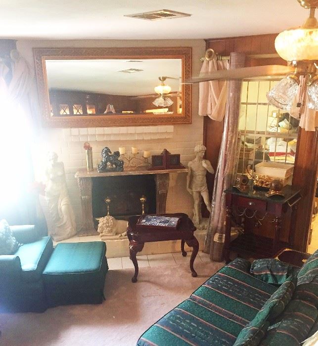 Sofa, arm chair with ottoman, side table, large mirror, statue of David, statue of Venus, desk, decorative items, candles, frames
