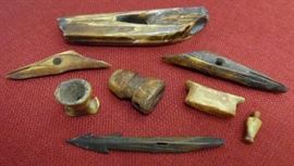 Eskimo fossilized ivory harpoon and spear points; pipe bowl; labret; seal float plug...