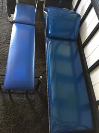 A whole outdoor room with exercise equipment for the serious workout person. 