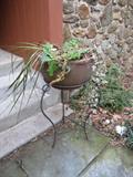 wrought iron terracotta planter