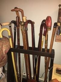 Beautiful cane collection! Some with sterling handles and 14 K bands.