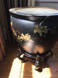 Large attractive planter on stand.