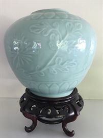 Chinese celadon vase on stand.