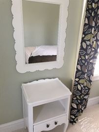 Sweet bedside table and wall mirror.