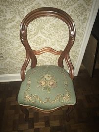 needlepoint chair with carved finger molding