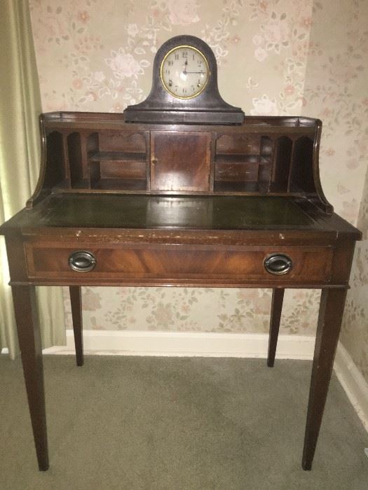 beautiful bural wood secretary with leather top and Seth Thomas mantle clock