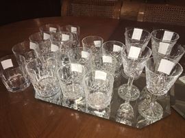 various collections of stemware by Lenox, crystal by Waterford and more