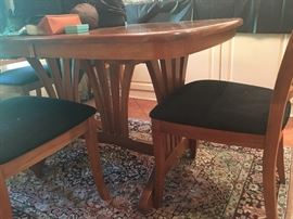 dining room table with 6 matching chairs and very nice area rug