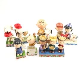 Jim Shore Peanuts Figurines: A collection of Peanut’s figurines by Jim Shore. This collection features seven figurines designed by Jim Shore and produced by Enesco including featuring the Peanuts gang including Little Miss Fussbudget #4044680, More Food Please #4049411, Good Man Charlie Brown #4044676, Campfire Friends #4049414, Life is Better with a Dog #4042387, Peace on Earth #4045883, and Practice Makes Perfect #4045874.