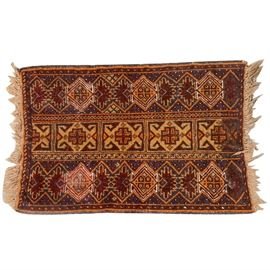Handwoven Caucasian Area Rug: A vintage hand-woven Caucasian area rug. The wool rug features three bands containing diamond and other geometric shapes, in a palette of blue, rust, orange, tan and white, with a natural warp fringe on the ends and hand overcast edges. The age and maker is not known.