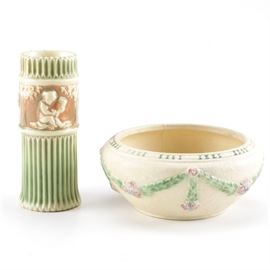 Roseville "Donatello" Vase and Bowl: A Roseville vase and bowl. This selection includes two pieces, one a bowl with a rosette motif and one a Donatello vase. Each item features a maker’s mark to the underside.