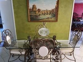 Beautiful dining set with scalloped glass top. Chairs are on casters.