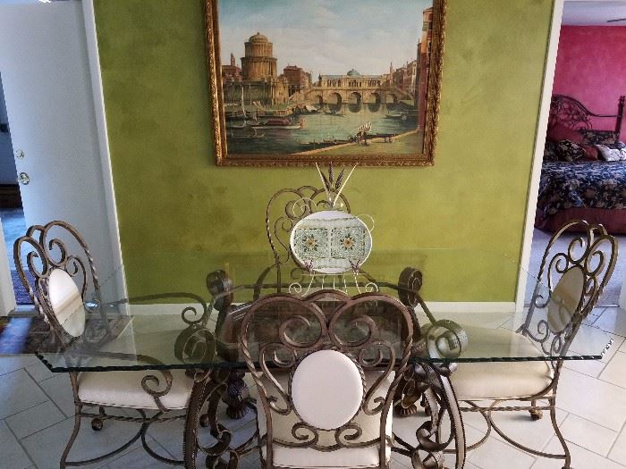 Beautiful dining set with scalloped glass top. Chairs are on casters.