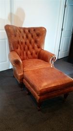 Southern Living Brown leather chair and matching ottoman.