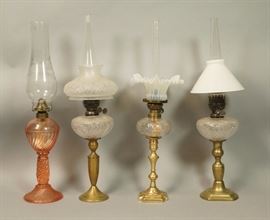 Lot 170 4pc Brass Oil Peg Lamps. Three brass candlestick 