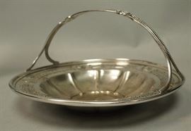 Lot 472 Sterling Silver Handled Basket. Wide pierced rim 