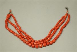 Lot 567 HEAVY TRIPLE STRAND RED CORAL BEAD NECKLACE. Hand