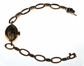 Lot 603 OMEGA Swiss 18K Gold Ladies Watch. Marquise shape