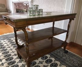 Best thing ever! So flexible - Two shelves, two drawers on this side. Marble top. This is on wheels or the wheels can be removed.