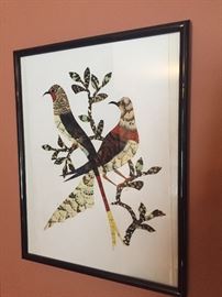 From Africa, crafted from cut and shaped bird feathers.