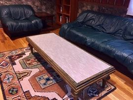 Funky glass top (fabric underneath the glass) coffee table with gold gilt wood.