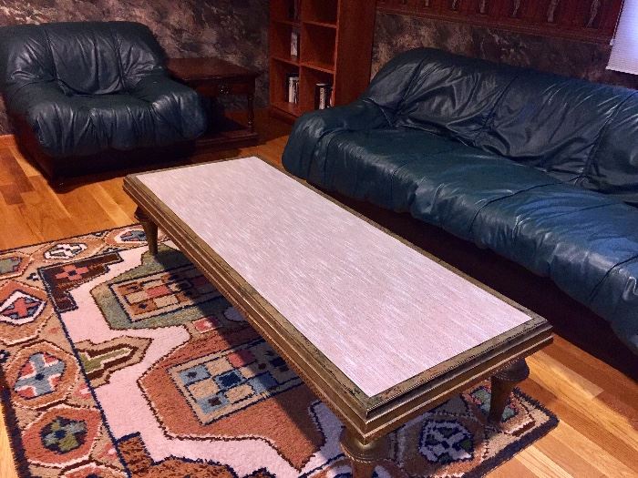 Funky glass top (fabric underneath the glass) coffee table with gold gilt wood.