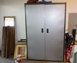 Gladiator garage storage system.  Cabinet and new in box cupboard