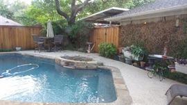Patio Furniture.  Cocktail height Table with 4 chairs, umbrella and umbrella base.  many small tables.  Large cement pots and planters