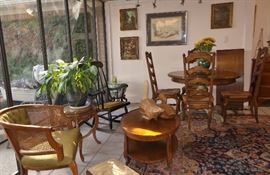 Heavy Breakfast table with 4 tall ladder back, thrush seats chairs. Stenciled rocker, vintage barrel chair, Victorian side table with removable tray, Asian urn table, Original framed art.  Live plants