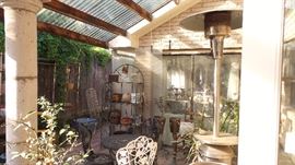 Beautiful patio with pots and plants, Tall gas heater, 2 baker's racks, Patio Table Set with 6 chairs
Patio Table Set with 4 chairs
Mosaic side and coffee tables
Iron candelabra and 2 bistro tables