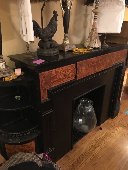 Beautiful Victorian fireplace mantle with side shelves and cabinets.