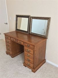Desk with two wall mirrors.