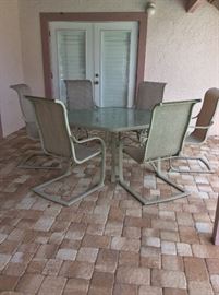 6-sided patio table and 6 chairs. 54" x62".