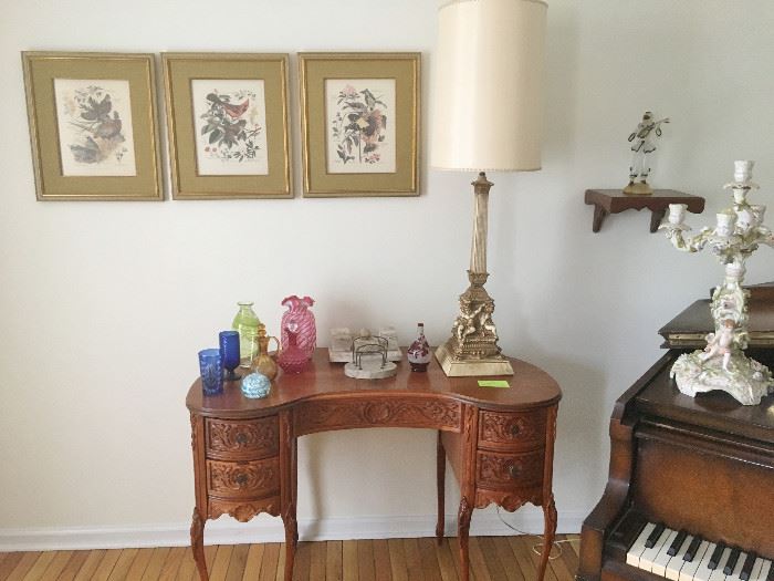 Beautiful carved kidney-shaped lady's desk. Vintage bird prints. Large cherub lamp. Vintage glass.