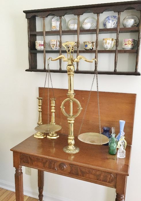 The antique scale is 30" tall and made of solid brass.