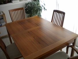 Kitchen table and four chairs(2armed) with built in leaf