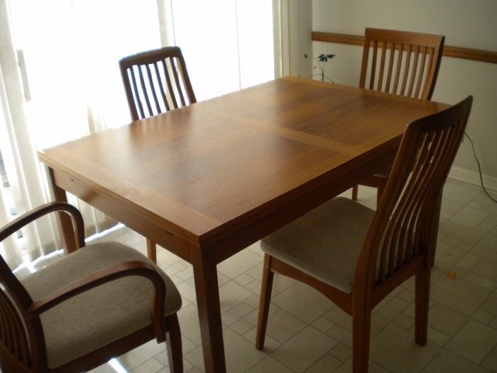 Kitchen table and four chairs(2armed) with built in leaf