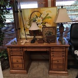 desk, old cameras, tripod, binoculars, lamps, art