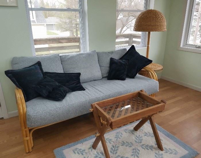Wicker sofa, and mid century table lamp