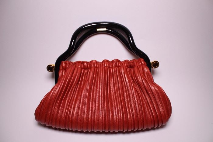 Bvlgari red leather handbag. Like new. Retail $3000+. STARTING BID: $500 -- FIND MORE ITEMS ON OUR LIVE AUCTION WEBSITE! 