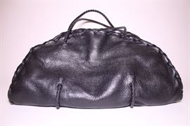Bottega Veneta black leather handbag. Like new. Retails $3750+. STARTING BID: $500 -- FIND MORE ITEMS ON OUR LIVE AUCTION WEBSITE! 