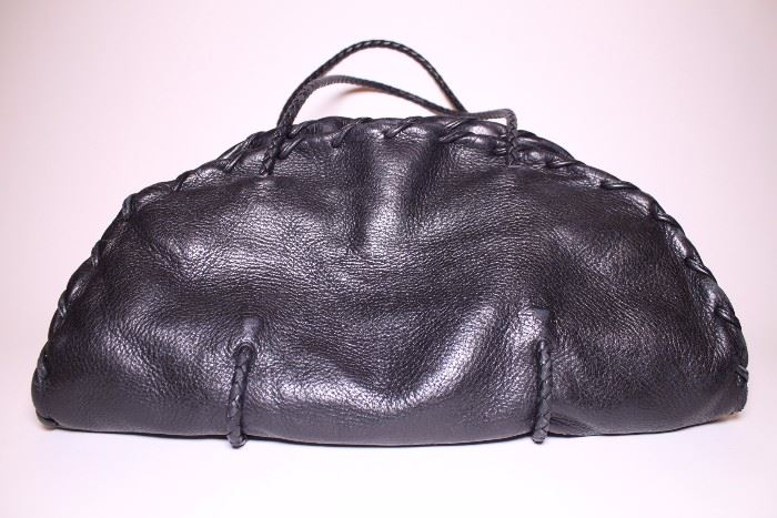 Bottega Veneta black leather handbag. Like new. Retails $3750+. STARTING BID: $500 -- FIND MORE ITEMS ON OUR LIVE AUCTION WEBSITE! 