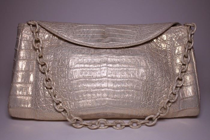 Nancy Gonzalez gold handbag. Like new. Retails $1300. STARTING BID: $250 -- FIND MORE ITEMS ON OUR LIVE AUCTION WEBSITE!! 