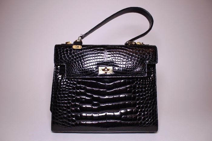 Lorenzi black ostrich handbag. Like new. Retail $5500+. STARTING BID: $400 --- FIND MORE ITEMS ON OUR LIVE AUCTION WEBSITE! 