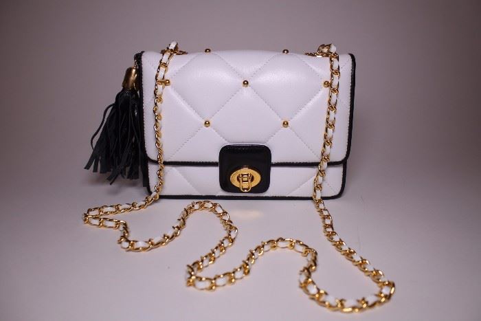 Ashneil black and white shoulder bag with gold shoulder chain. Like new. Retails $450+. STARTING BID: $100 --- FIND MORE ITEMS ON OUR LIVE AUCTION WEBSITE! 