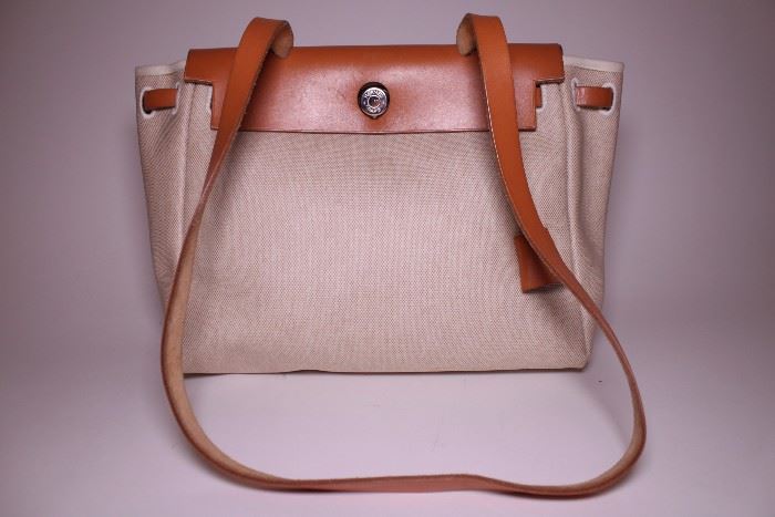 Hermes canvas shoulder bag. Like new. Retails $2000-$4000. STARTING BID: $400 -- FIND MORE ITEMS ON OUR LIVE AUCTION WEBSITE!