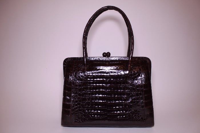 Nancy Gonzalez brown crocodile handbag. Like new. Retails $2500-$3000. STARTING BID: $500 --- FIND MORE ITEMS ON OUR LIVE AUCTION WEBSITE! 