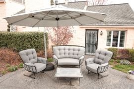 1 of 4 oversized and light-grey cushioned patio spring chair. O.W. Lee Co. from Jack Wills Furniture. Approximate Retail $1500.