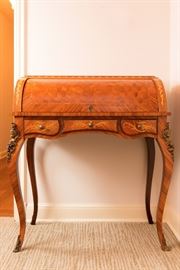 Louis XV Style Brass Ormolu-Mounted Tulipwood and Parquetry Crossbanded Bureau de Cylindre (Ladies Desk), mid-late 20th century. Est. $ 1,800 – 2,400.